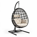Hanging egg chair with soft cushion in beige and black metal frame