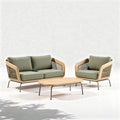 Outdoor rattan living room sofa set with green cushions and wooden coffee table